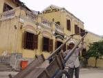Working man in front of Song Hoai - Hoi An, Central Vietnam