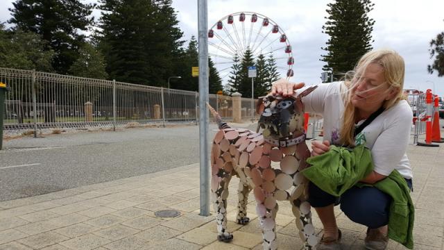 Petting a copper dog - Fremantle harbourside, Western Australia