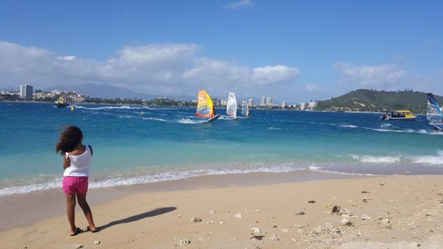 Wind and Kite surfers in Anse Vata Bay - Noumea, Duck Island, Ile aux Canard, New Caledonia