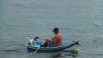 Man and dog in boat - Manly Beach, Sydney, New South Wales, Australia